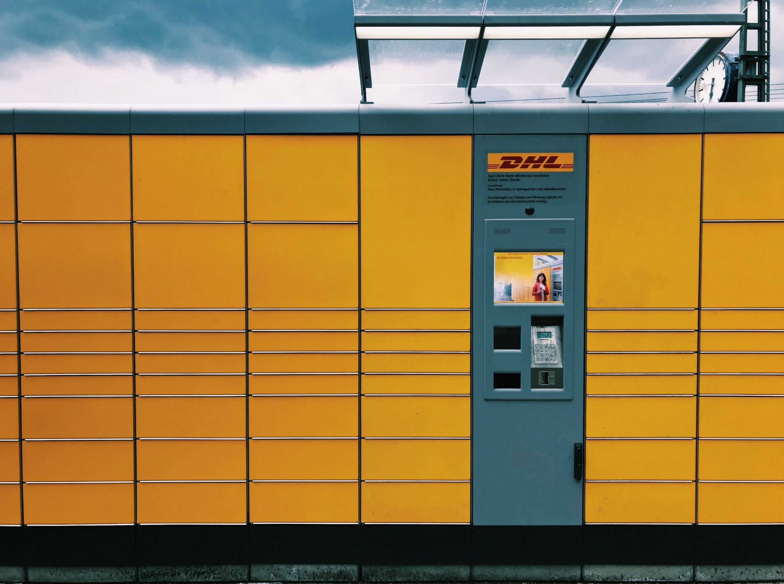 DHL parcel locker self-service kiosk.