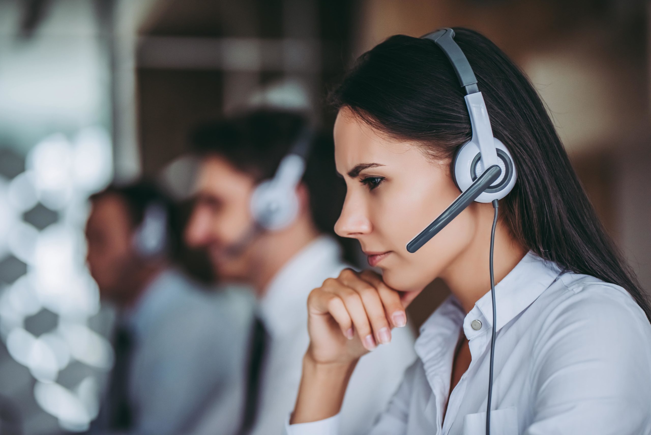 Call centre agent looking at computer.