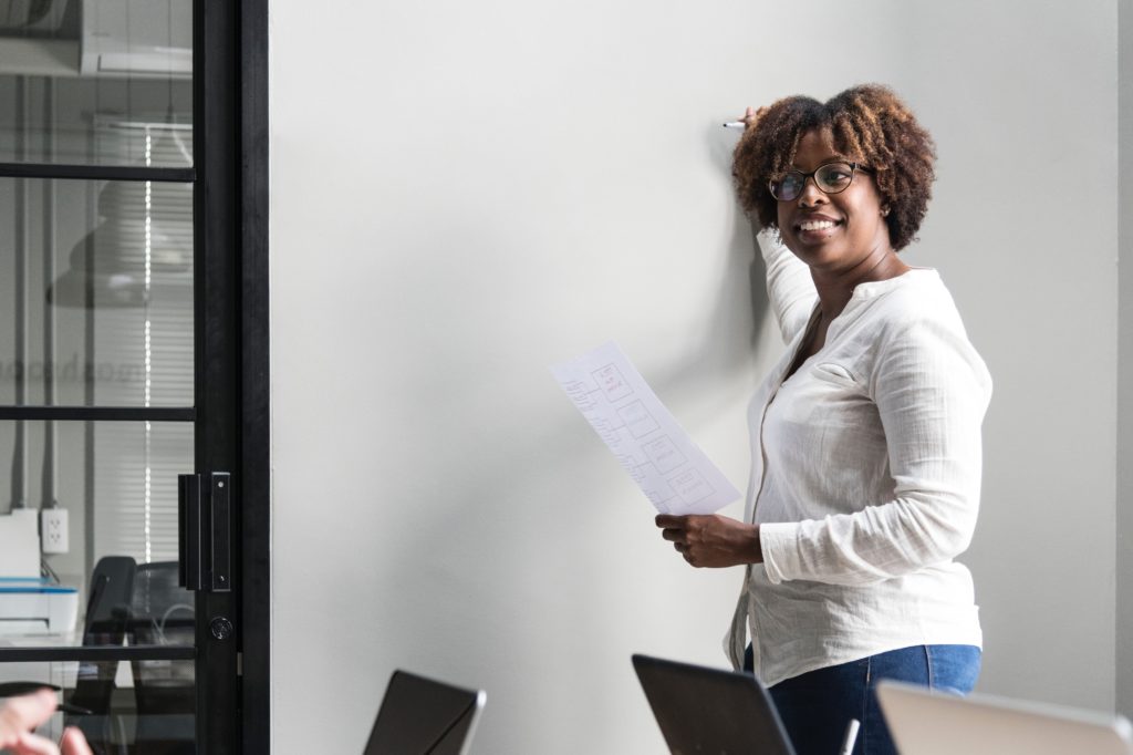 Woman holding a call centre training workshop.