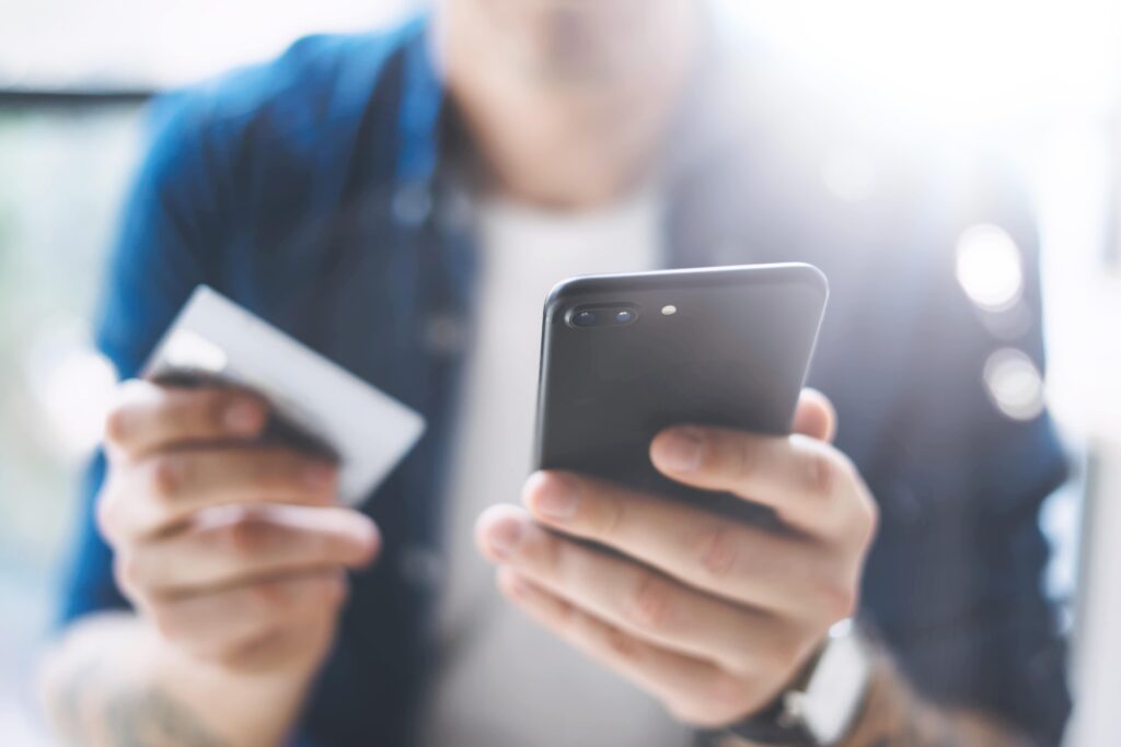 Man making a credit card payment over the phone.