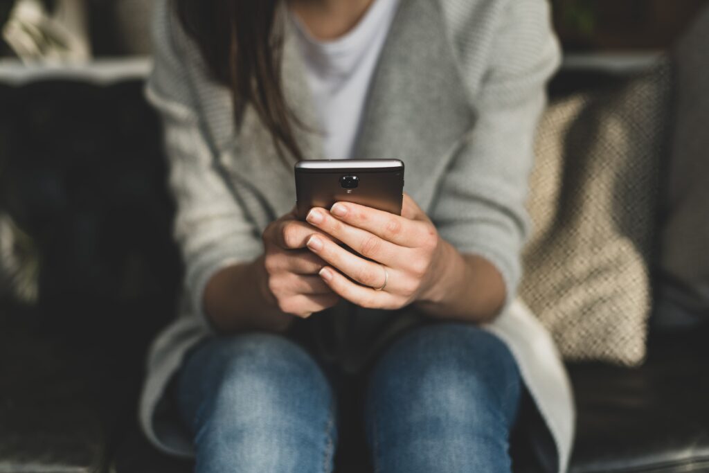 Person receiving a text on their phone.